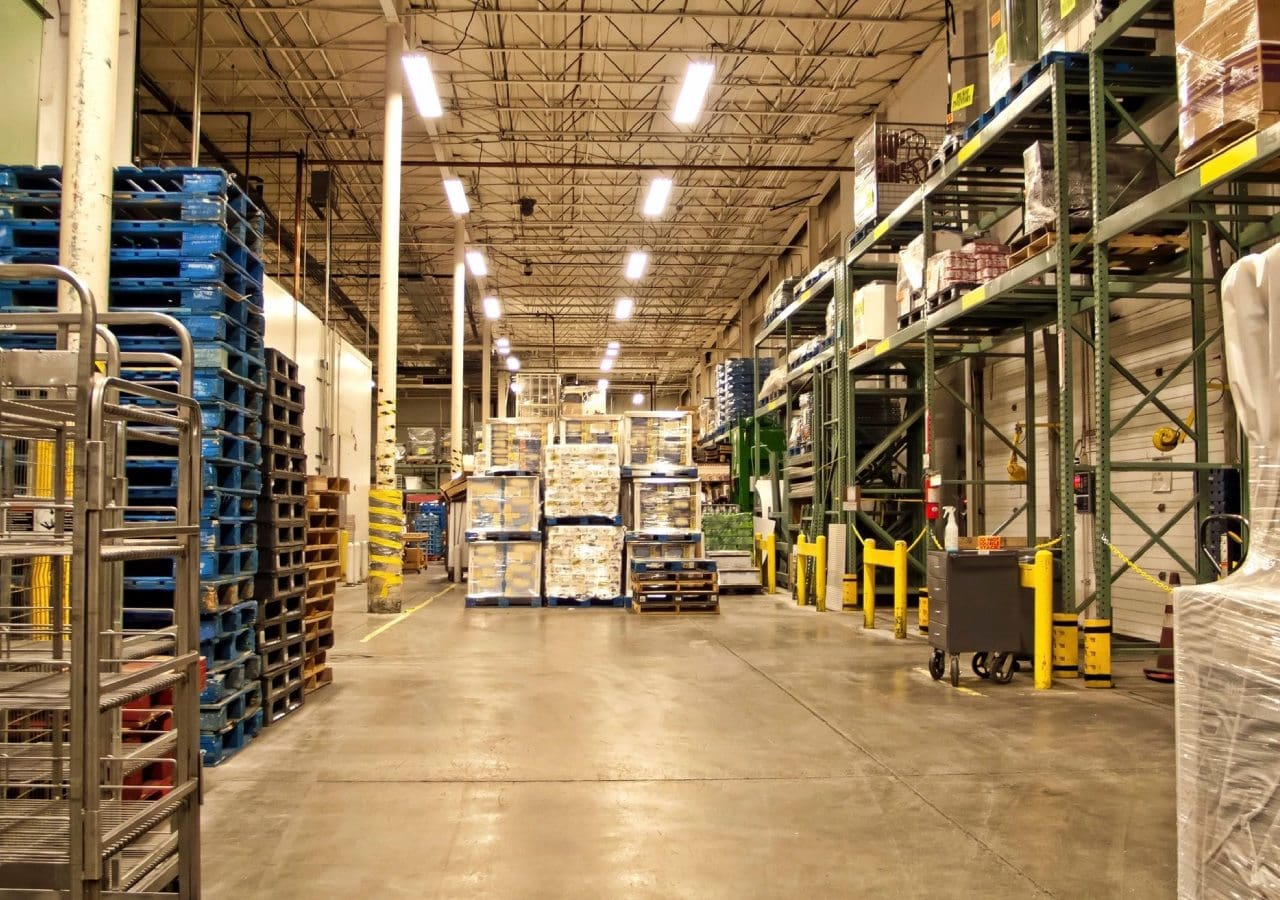 A warehouse filled with lots of pallets and boxes.